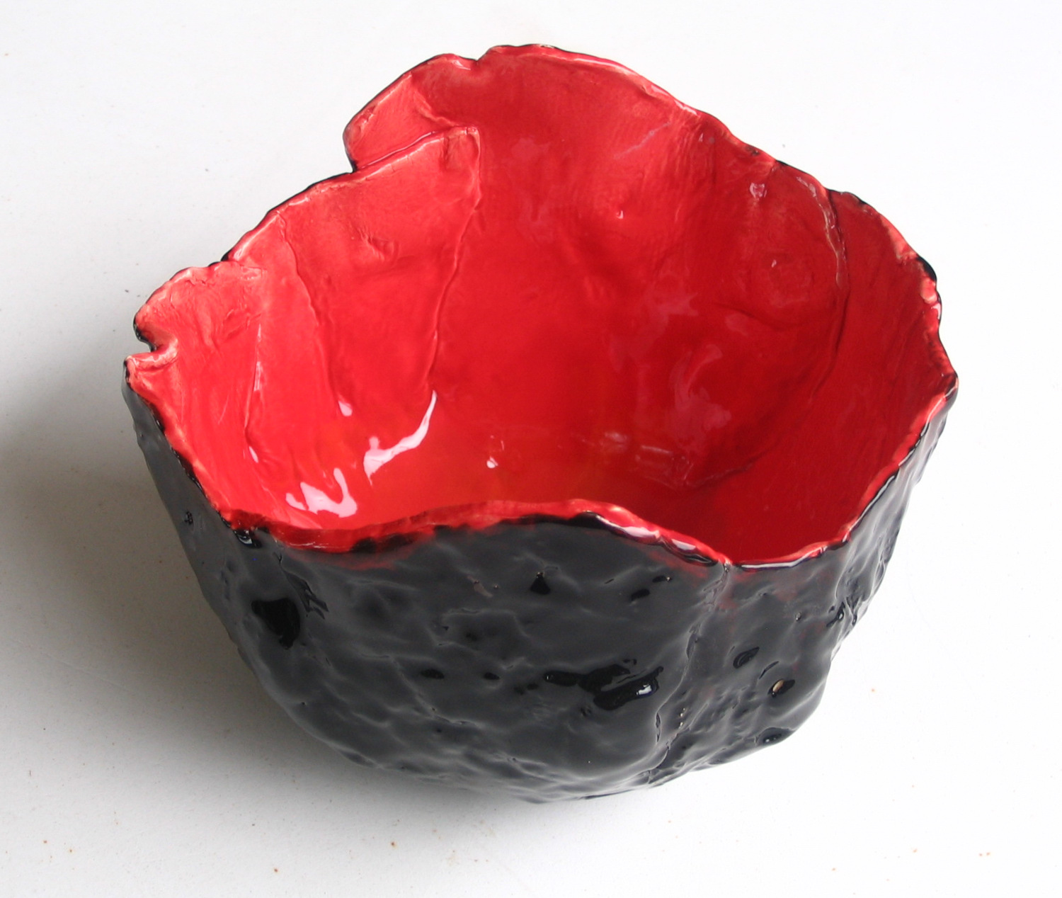 Red bowl with black patterned exterior
